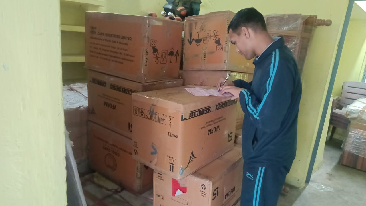 DTC International Packers Team packing cartons
